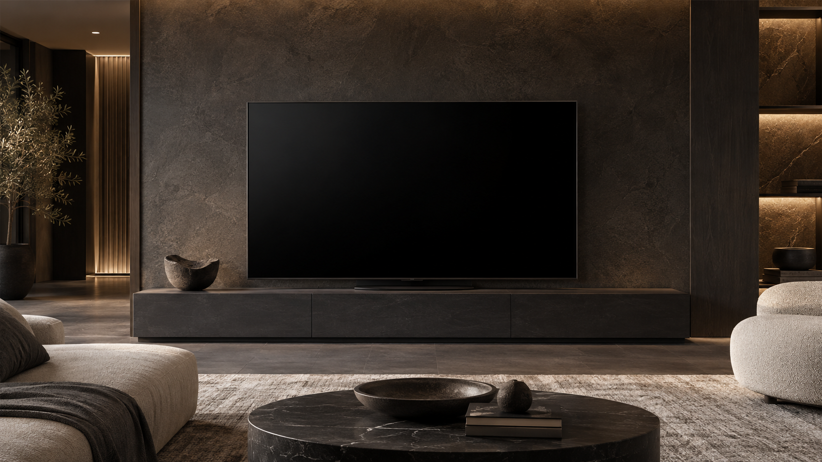 A quiet modern room with a television and soft architectural lighting